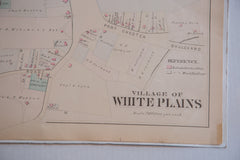 Antique map of the village of White Plains showing Broadway, the Bronx River, Railroad Ave, and various other streets and buildings.