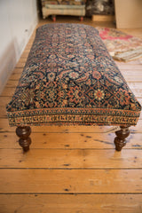 Antique Persian Fereghan rug ottoman detail: dense patterns, distinct border, navy, saffron, ivory.