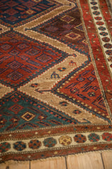 Detailed view of the stepped lightening contour and rich colors of an antique Persian rug.