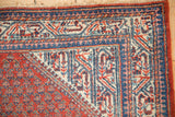 Vintage Serbend rug corner, featuring reciprocating pawn design border in cherry red, ivory, blue.
