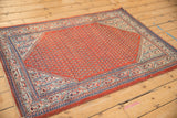 Persian Serbend rug corner, cherry red boteh field and sapphire blue pawn border.