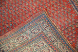 Vintage Serbend rug's sapphire blue pawn motif border and cherry red field.