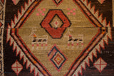 Kurd origin hand-knotted fragment, tribal geometric pattern with camel motifs in earthy tones.