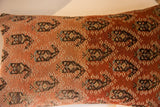 Hand-knotted antique Malayer rug fragment pillow showing distinct abrash and dark tribal patterns.