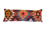 Colorful vintage Kilim rug fragment pillow with geometric patterns and bright hues, 12x29