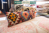 Colorful geometric pattern detail on a vintage 1960s Kilim fragment pillow.
