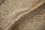 Distressed short pile and muted beige abrashes of this vintage Kars carpet.