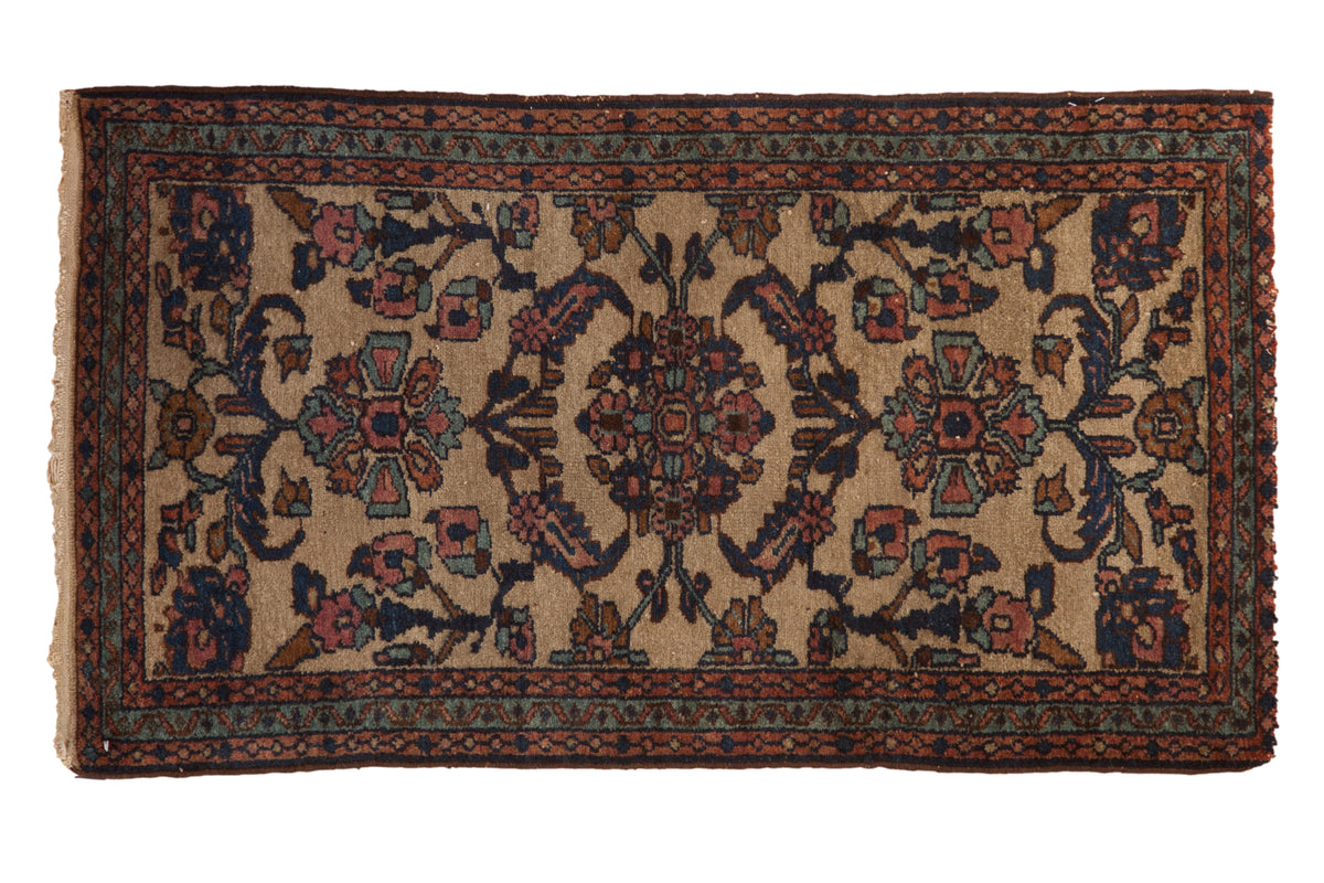 Vintage Persian Mehriban runner rug with a floral bouquet in cobalt blue and terracotta over a beige field.
