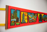 Textured red felt pennant with 1970s NYC Pan Am and Empire State Building graphics.
