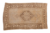 Distressed Oushak carpet with central diamond medallion in faded ivory and brown, 5'3