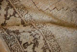 Textured vintage distressed Oushak rug with areas of exposed foundation and knot heads.