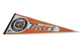 Close-up of the vintage Detroit Tigers pennant's circular logo and black felt edge.