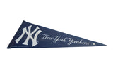 Vintage New York Yankees felt pennant, navy blue with white logo and script, showing minor creases.