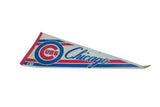 Vintage Chicago Cubs felt pennant, showing red and blue team logo, script, and aged tones.