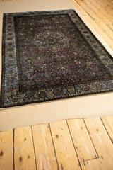 Deep purple and blue palette of the antique silk Kashan rug's lustrous dark side.