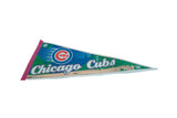 Close-up of Chicago Cubs pennant featuring blue brick, green ivy, and team logo.