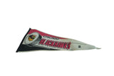 Vintage Chicago Blackhawks felt pennant showing its aged patina and angled shape.