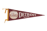 Vintage 1960s Detroit Michigan pennant, maroon felt with white skyline graphic and text.