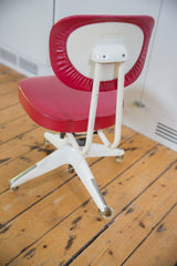 Okamura swivel chair back and seat: aged red vinyl, ivory cream frame with patina.