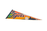 A close-up view of the Detroit Tigers logo and navy blue spine on the vintage felt pennant.