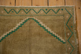 Vintage Distressed Oushak rug corner, emerald green and ivory stepped prayer spandrel.