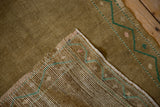 Hand-knotted foundation and ochre distressed pile of a vintage Oushak rug.