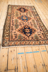 Angled view of a vintage Mehriban rug showing the lustrous sheen across its traditional design.