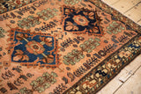 A weaver's signature visible in the corner border of a fine vintage Persian Mehriban rug.
