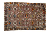 Antique Caucasian rug with unusual mauve ground, allover geometric design, floral blossoms, and abrash.