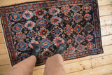 Vintage Bibikabad rug with repeating panels of cherry red and blue, shown in use to display its scale.