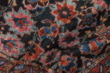 Plush hand-knotted pile of a collector Bibikabad rug showing its rich navy, fuchsia, and blue motifs.