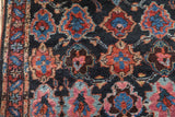 Original side cord selvage and even pile on a vintage Bibikabad rug with red and blue repeating panels.