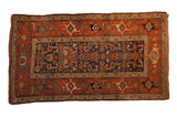 Antique Kurdish Hamadan rug with a navy Herati design field and a wide terracotta Samovar border.