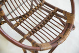 Textured dark brown and light tan rattan weaving detail on vintage kid's chair.