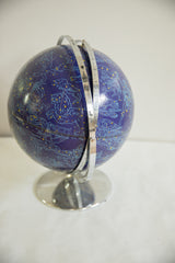 Vintage astrology globe with deep blue surface, Cancer and Leo constellations, chrome arm.