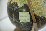 Vintage Rand McNally World Globe label, North American map, aged surface.