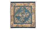 Antique Chinese Peking square rug with a roundel medallion on a sky blue field and ivory floral borders.