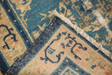 Hand-knotted foundation and intact side cord selvage of an antique Peking square rug.