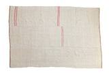 Multi-panel vintage hemp kilim rug in a neutral beige with simplistic offset pink stripes.