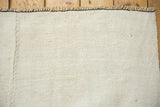Detail of a hand-stitched seam connecting panels of a vintage hemp kilim carpet.