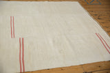 Hand-seamed join on a multi-panel vintage hemp kilim with offset pink stripes.