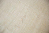 Detail of the embossed numbers on the hand-woven vintage hemp kilim carpet.