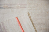 Close-up of a vintage hemp kilim corner showing the flat-woven back with terracotta stripes.