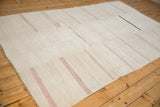 Vintage hemp kilim carpet showing its full length, seamed panel construction, and soft horizontal stripes.