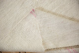 Detail of the hand-woven plain weave and construction on the back of a vintage hemp kilim.