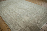 Distressed beige and platinum Tabriz design border with geometric vinery, showing faint foundation.