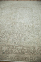 Distressed vintage Turkish Tabriz carpet with beige, silver, and pale blue geometric floral vinery.