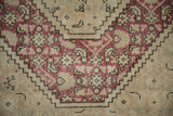 Distressed vintage Turkish Tabriz rug, raspberry red stepped pattern, low pile.
