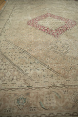 Distressed Turkish Tabriz carpet detail: shield finial and faded Herati field.