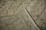 Distressed Turkish Tabriz design carpet's machine-bound edge, reverse, and color differential.